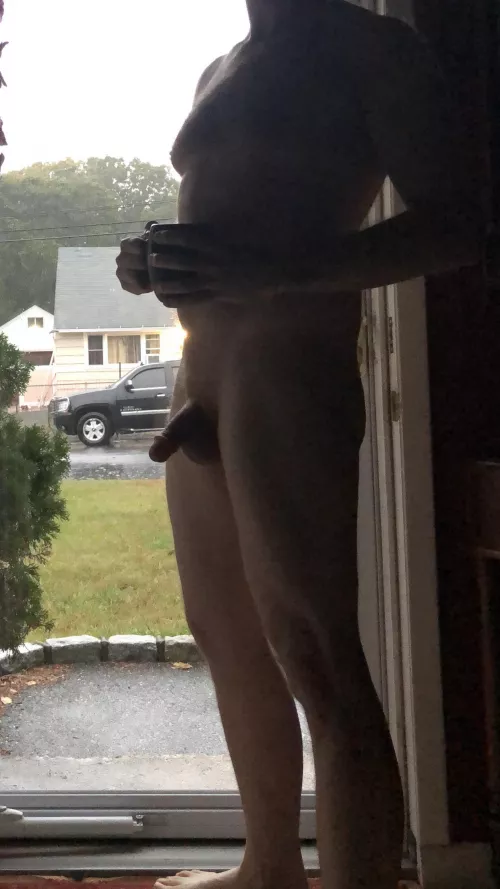 Here comes the rain again...the petite latina who lives across the street gave me a friendly wave as she took the trash to the curb in her wet nightie. by NudistAwareness