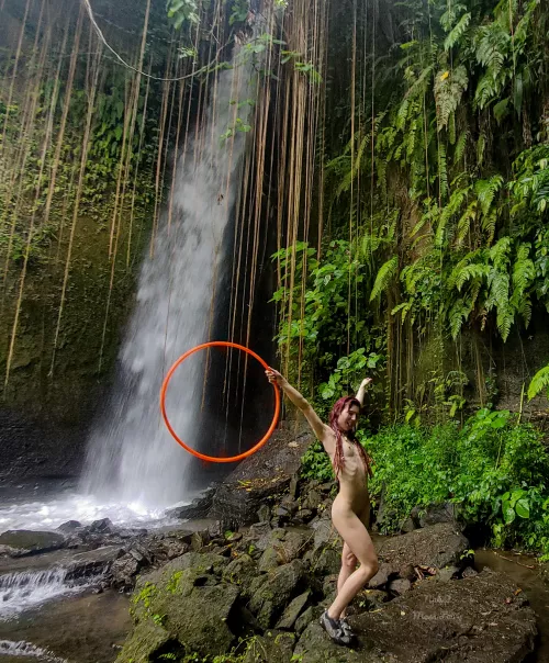 I feel euphoric anywhere next to a waterfall, especially when I get to play with my hula hoop naked!🥰💦 by NakedMossFairy