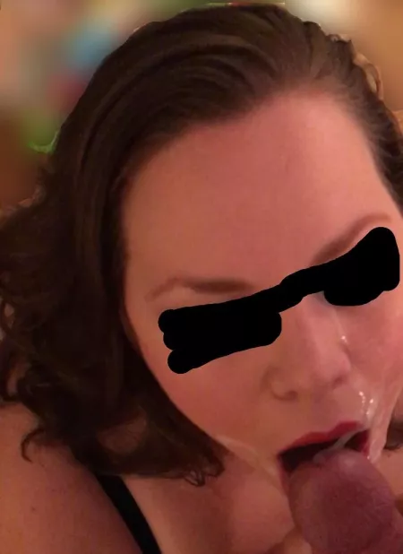 I like how this shot shows the cum stretching from my cheek to my mouth. Yum! (FM) by TitsInCali