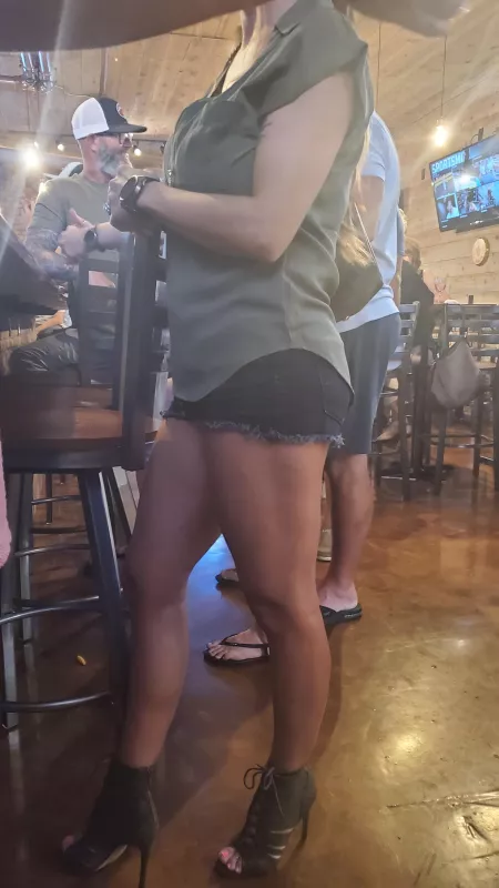 I wear short shorts and heels because I know how much my husband loves it. The fact that he took a picture of me while I was ordering a drink is proof that he does. by kbass2_0