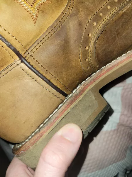 Is this little split on the heel of my fucking boots a big deal? Paid big money for these. by AC2BHAPPY
