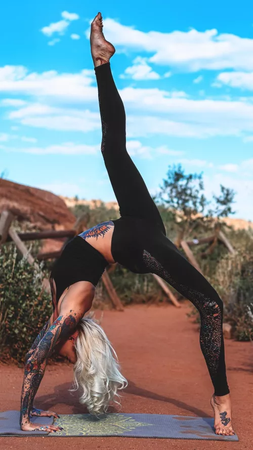 Leggy yoga girl Brittany Wilcox doing a one-legged wheel pose. Happy Monday! by YogaPhotographer