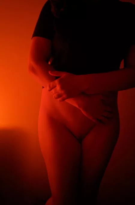 Light from an amber-colored stained glass lamp by littlemiddlemissy