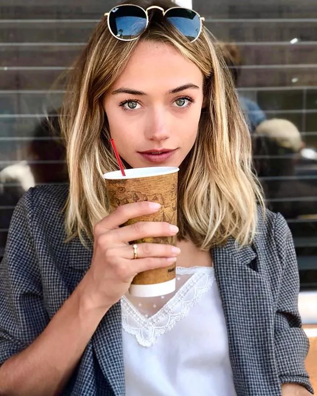 Livy Poulin has a dainty ring and a big cup of coffee posted by abitm