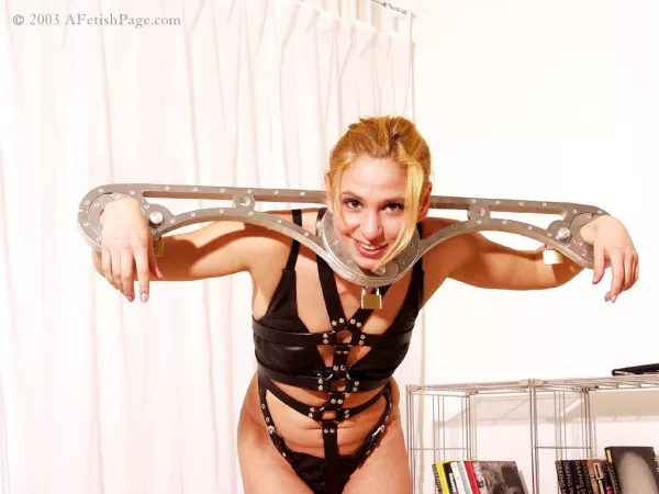 Looking happy despite the circumstances by chastitylover