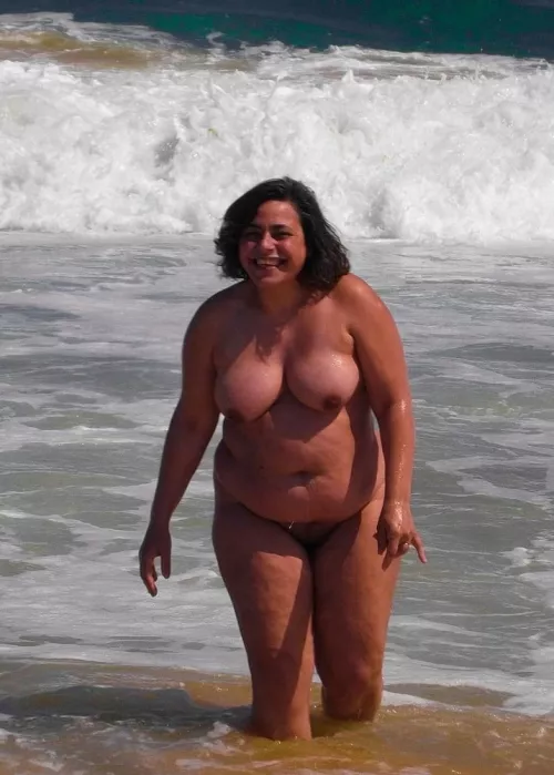 Lovely plump nudist frolicing in the waves by Udderluvr2020