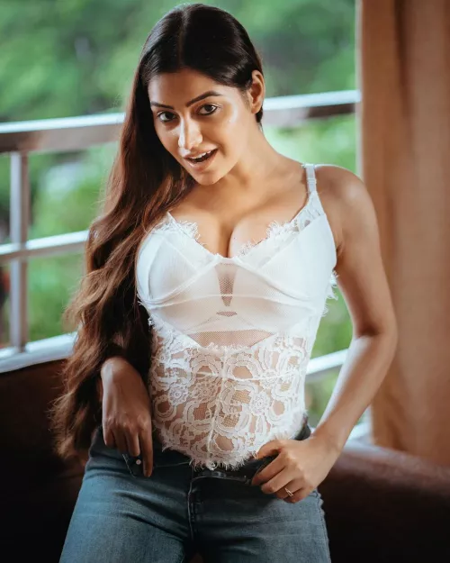 Model in Lingerie outfit and jeans by Huddlestone