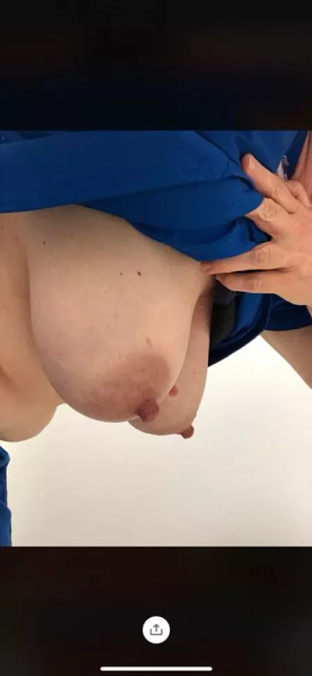 My kitty hangs loose from under the scrubs by icthus_medicus