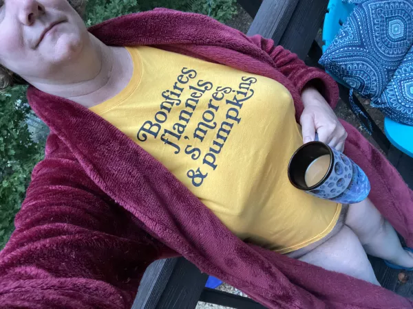 My kitty has a warm mug on a cool morning by icthus_medicus