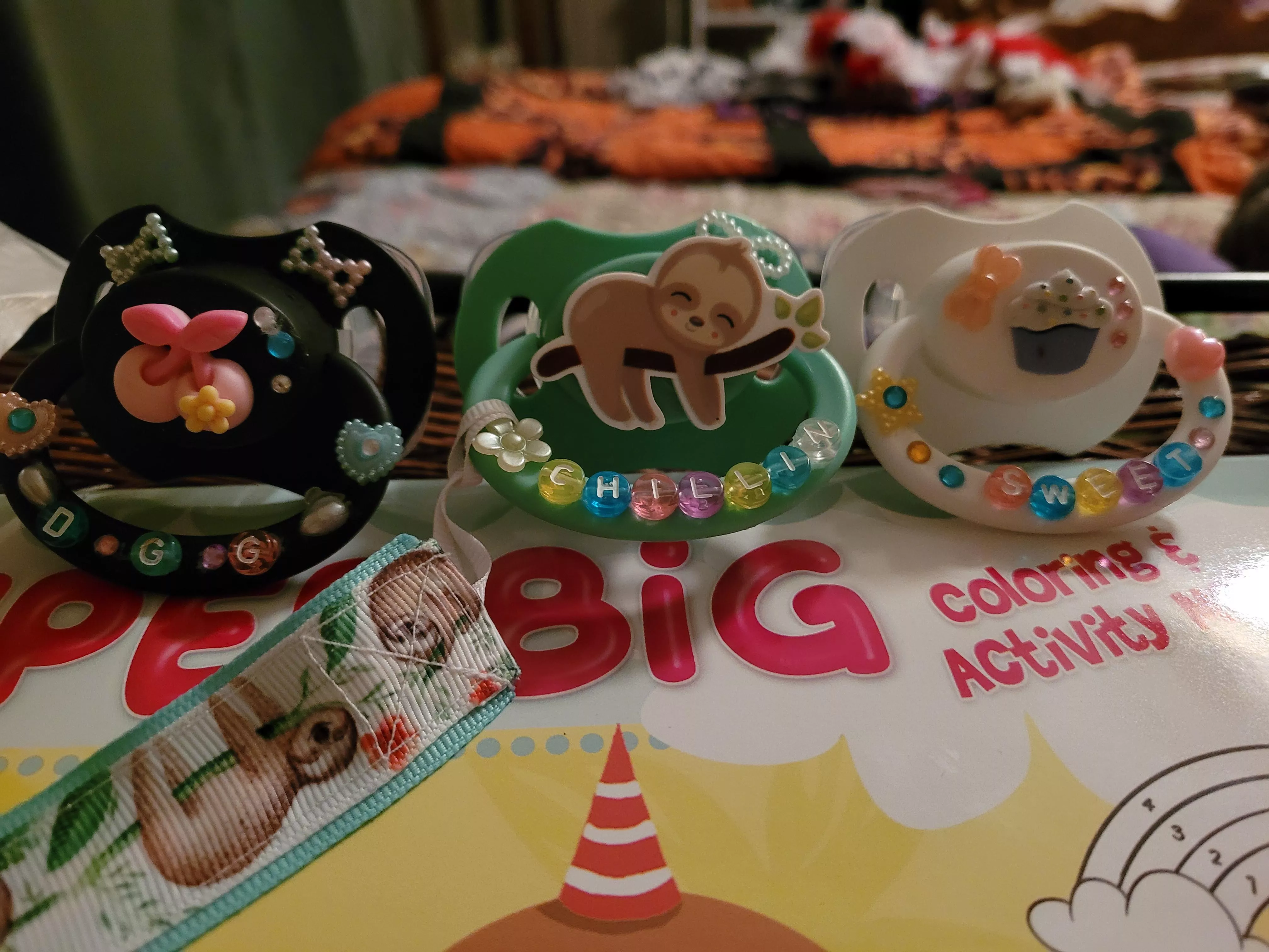 My new paci's. I made the cupcake one and Daddy made the cherry one. Funny daddy says he wants to make me a couple more. posted by Cupcake-G
