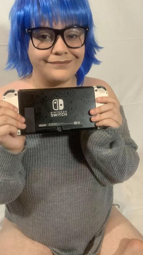Nikki faking a smile when gifted a newer gaming console by scoobsboob