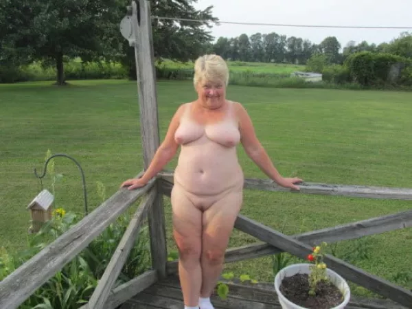 Older plump nudist posing on the back deck by Udderluvr2020