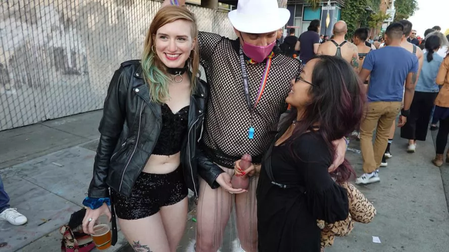 One cradling his balls, one holding his stiff cock - all in public and all happy! by Public-Erection-CFNM