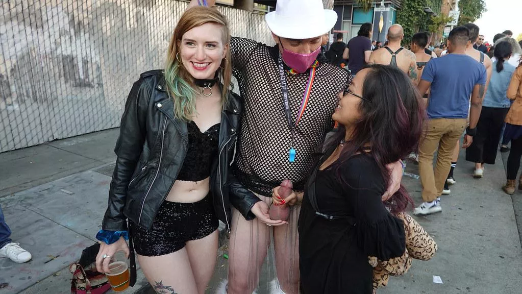 One cradling his balls, one holding his stiff cock - all in public and all happy! posted by Public-Erection-CFNM