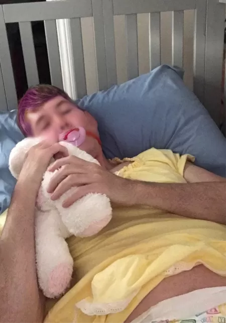 Pic of me in my crib where I sleep every night. Mommy dressed me in my fav yellow nightie last night. by luvmymommy23