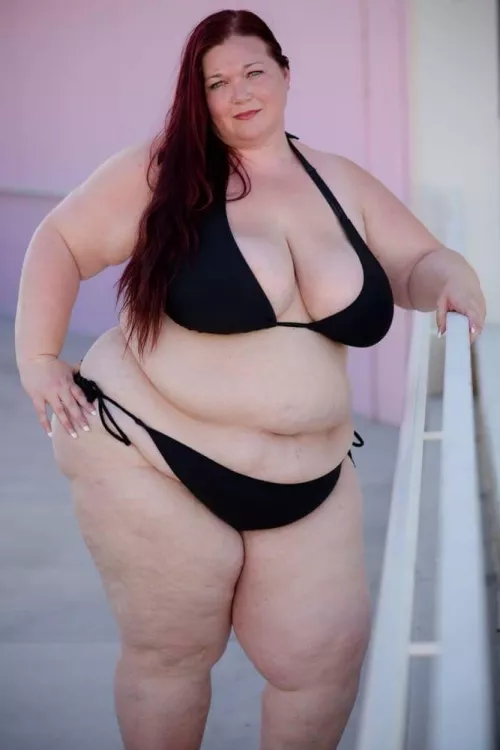 Plump and pale redhead in a black bikini by Udderluvr2020