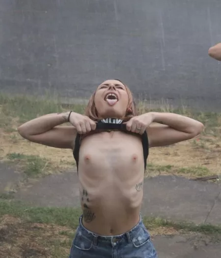 Public street in the rain by petite_blonde_wife