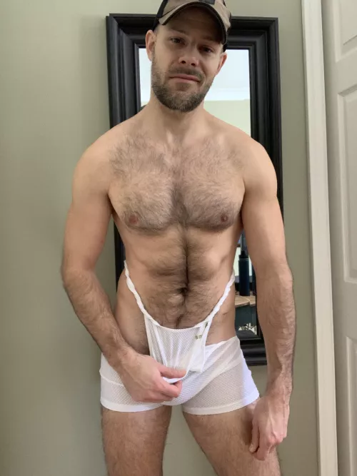 Pulling off my sweaty singlet.