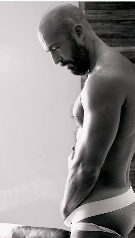 Reaching into his jockstrap (X-Post /r/buffnbald) by menareamazing