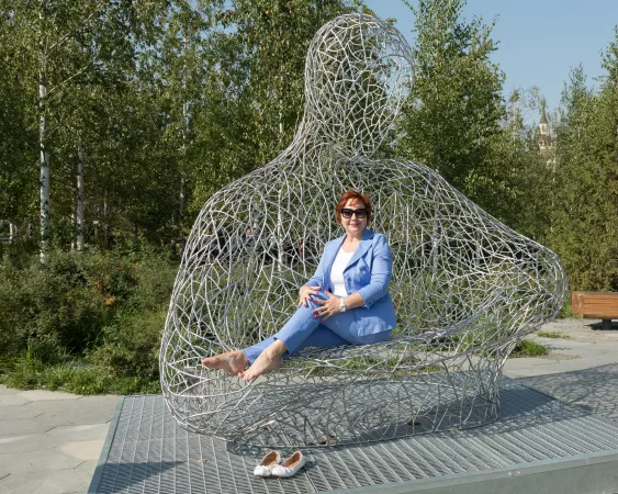 Redhead on a metal park bench by sexyfeetexpo