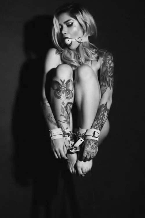 She's a little bit tied up by tapednude