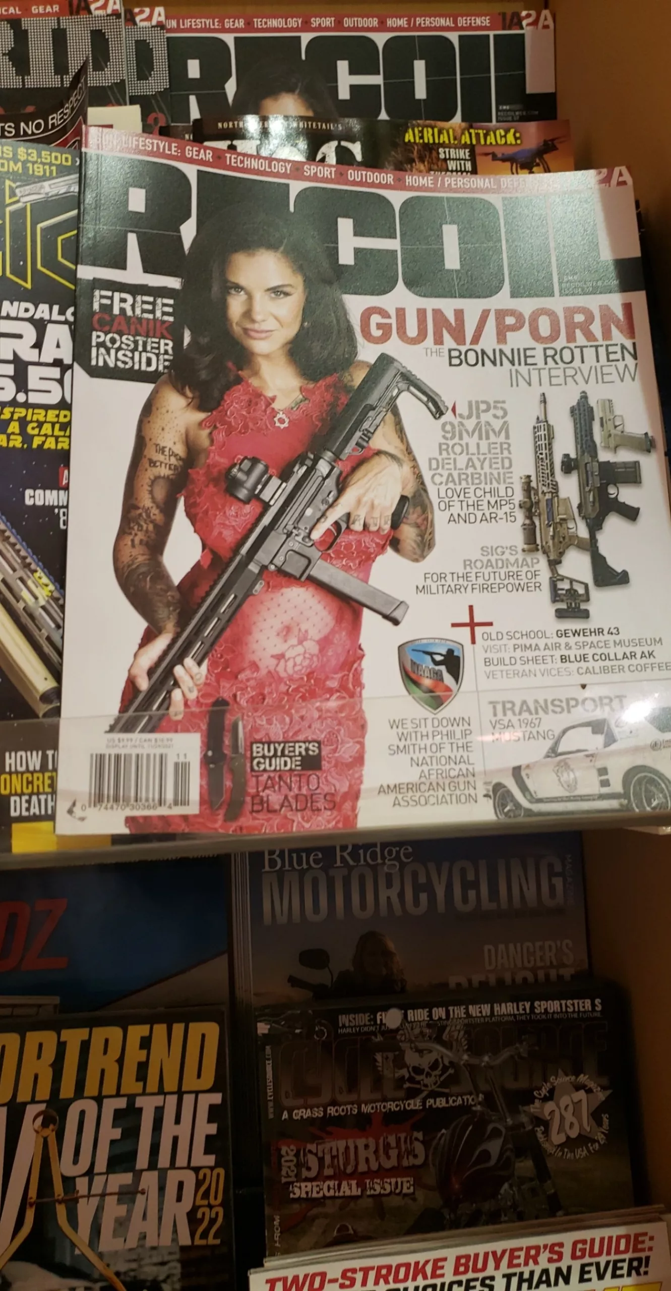 shes in a gun magazine. posted by playing_ketchup