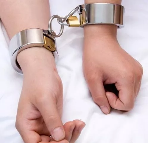 Shiny cuffs posted by chastitylover