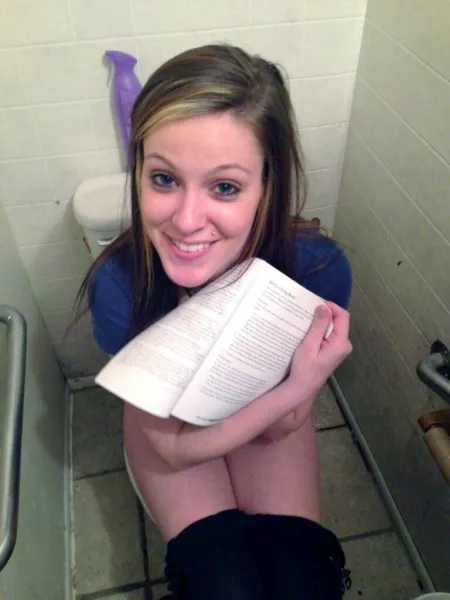 Showing us her reading material by CatpainTpyos