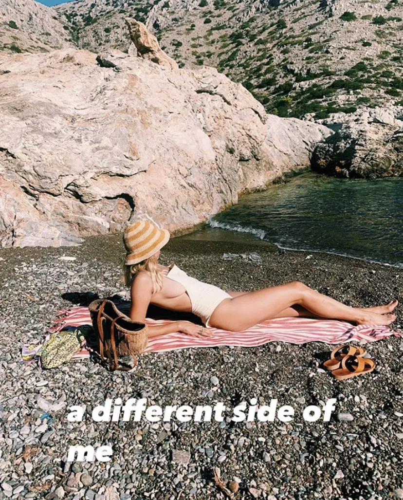 Sideboob on the beach posted by Fellybeel