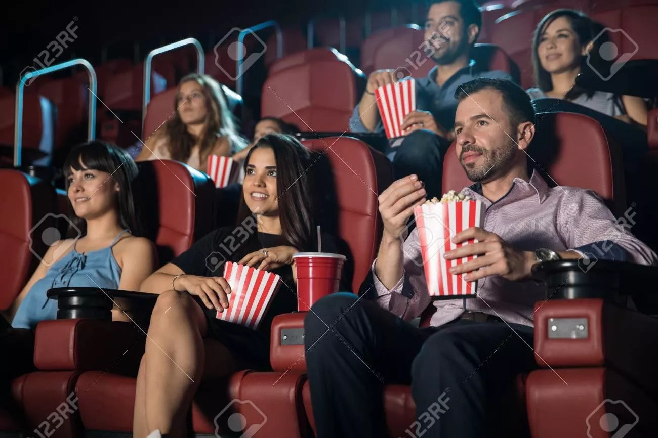 Small audience of adults watching a movie and eating snacks posted by [deleted]