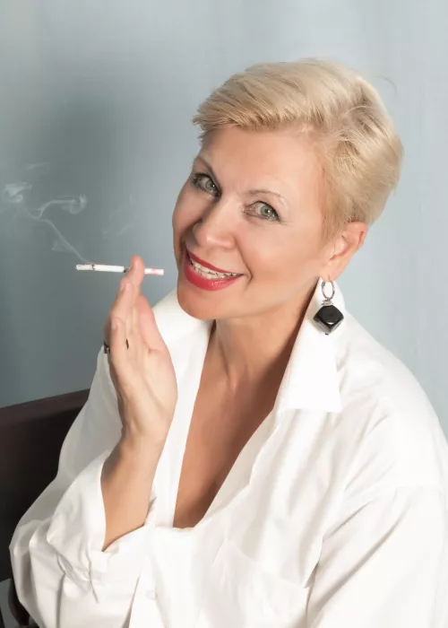 Smiling lady in white shirt with cigarette by sexyfeetexpo