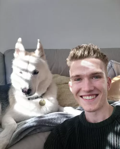 Snow dog chilling in the sun by oskarmercury