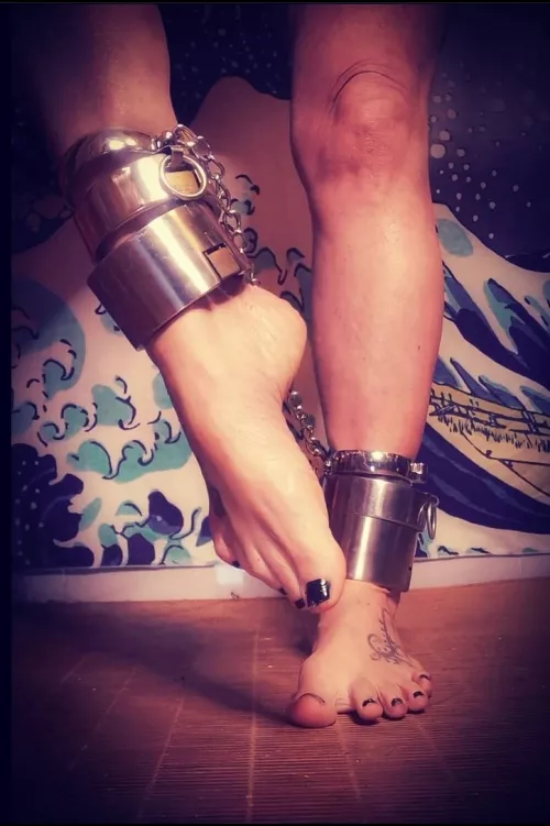 Steel over my feets, the sweetest embrace. by Nekotied