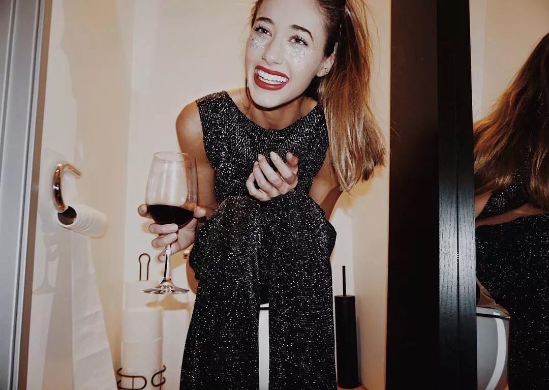 Still enjoying her wine. posted by luv_to_race