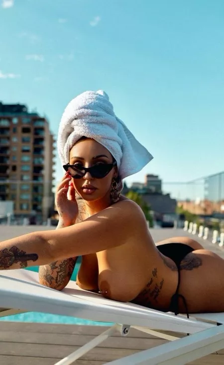 Sunbed, towel and tattoos by [deleted]