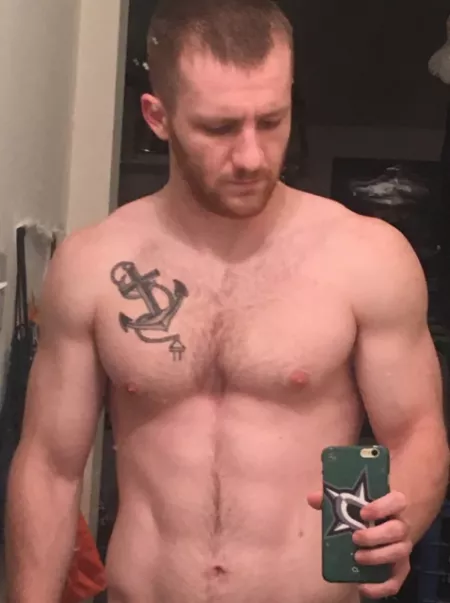 Taking a selfie of his chest by menareamazing