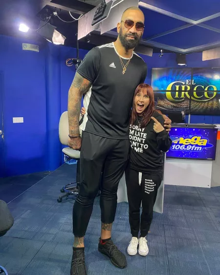 This radio host with a basketball player by Guzabra
