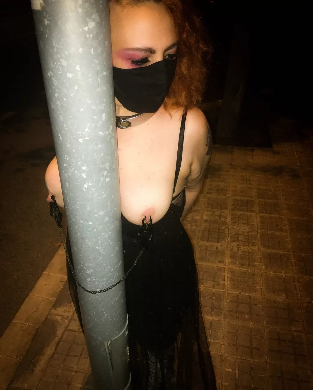 Throwback time. My nipple clamps around the streetlight pole, exposed and ready to be used. posted by Nekotied