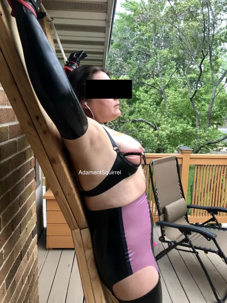 Tied to the cross in latex on the deck. Too bad my neighbors aren’t more observant! [F] OC by AdamentSquirrel