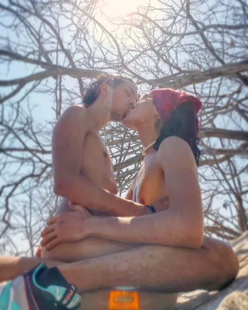 Two lovers on a rock by the beach... by HungLalo