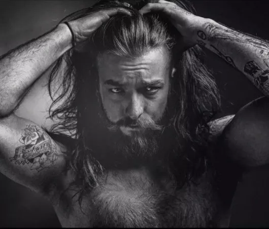 Viking binding his hair by Anatolysdream