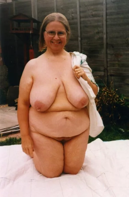 Vintage BBW nudist gettijg ready to lay out in her yard by Udderluvr2020