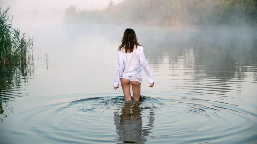 wading through a pond on a foggy day by JuliaSeth