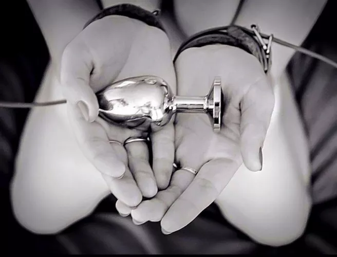 Waiting for her master to cuff and plug her. by FluktarnX