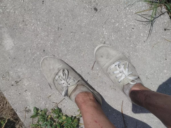 Yard work gets me dirty. Can't wait til I can sit down and take my shoes off. by ZefieATG