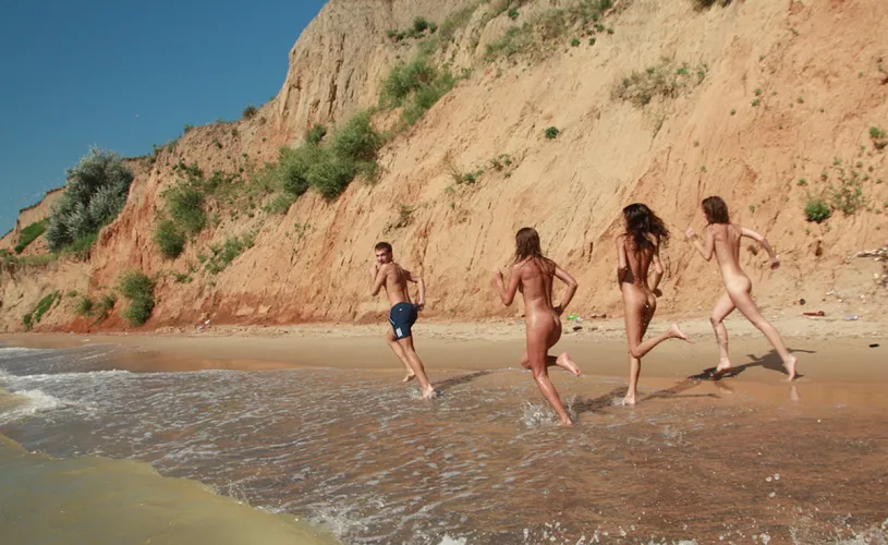 Yeah, you better run man! Swimsuits are forbidden here. by NaturistPictures